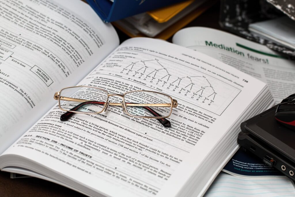 eyeglasses on open book