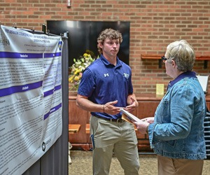 student discussing project with faculty